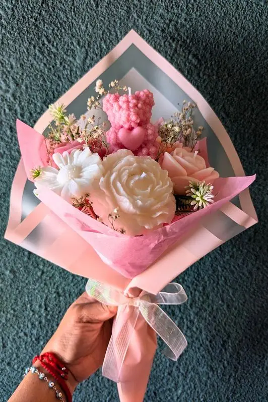 Candle bouquet wrapped in pink paper