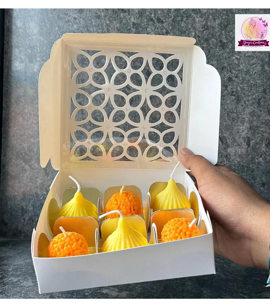 Festive candle gift box with a laser-cut lid
