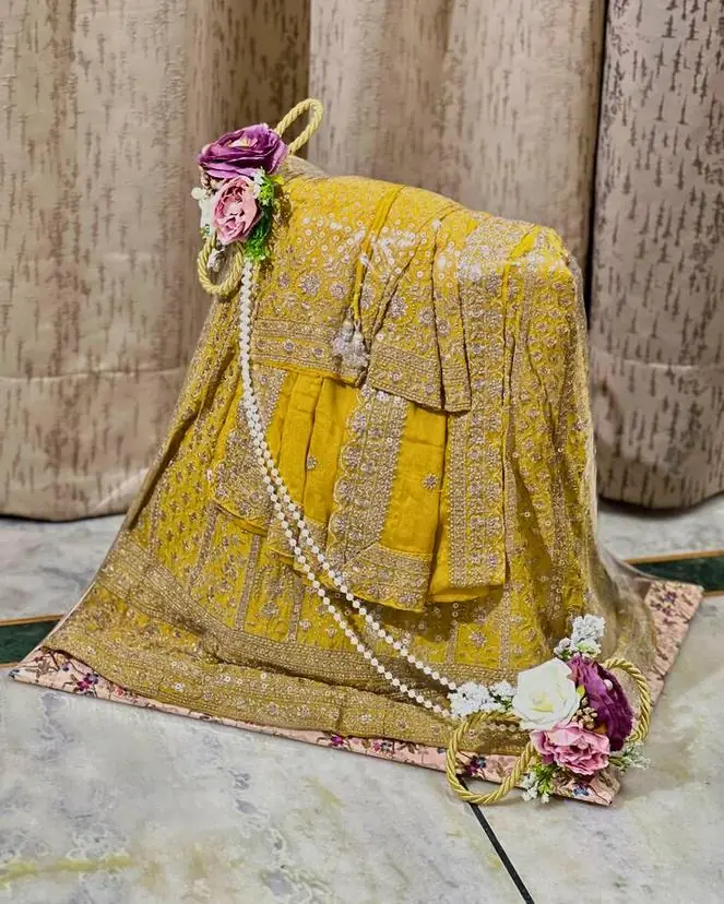 Mustard embroidered outfit packed with pearls and flowers