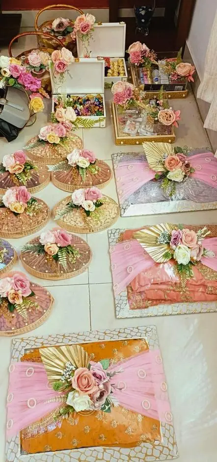 Rows of floral trousseau trays in pink and gold